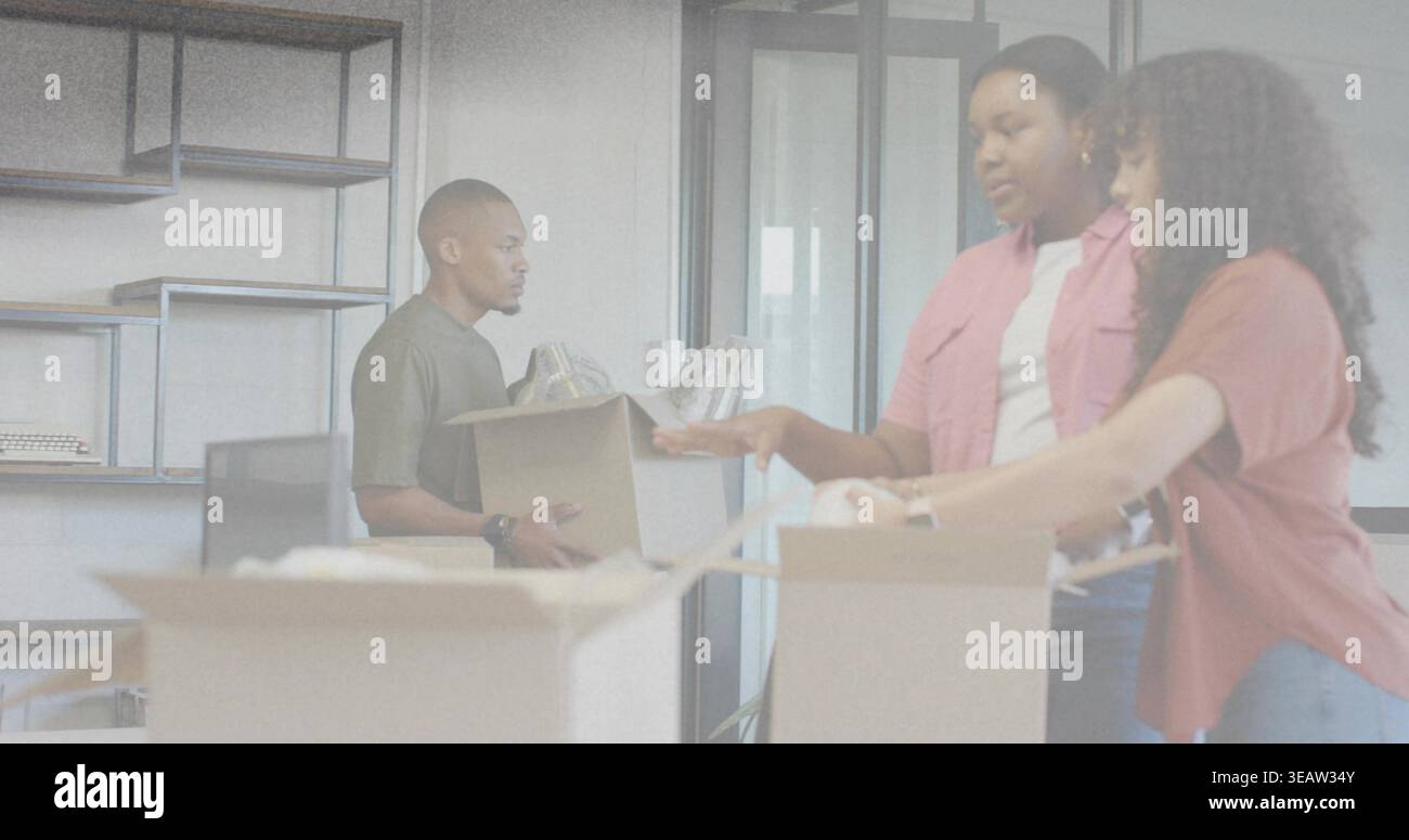Packing three colleagues in casual shirts arranging cardboard boxes at office with bubblewrap Stock Photo