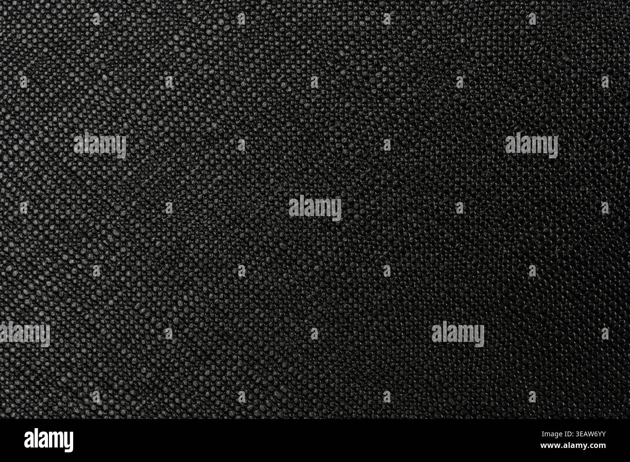 Black soft cloth dotted surface material macro close up view Stock Photo