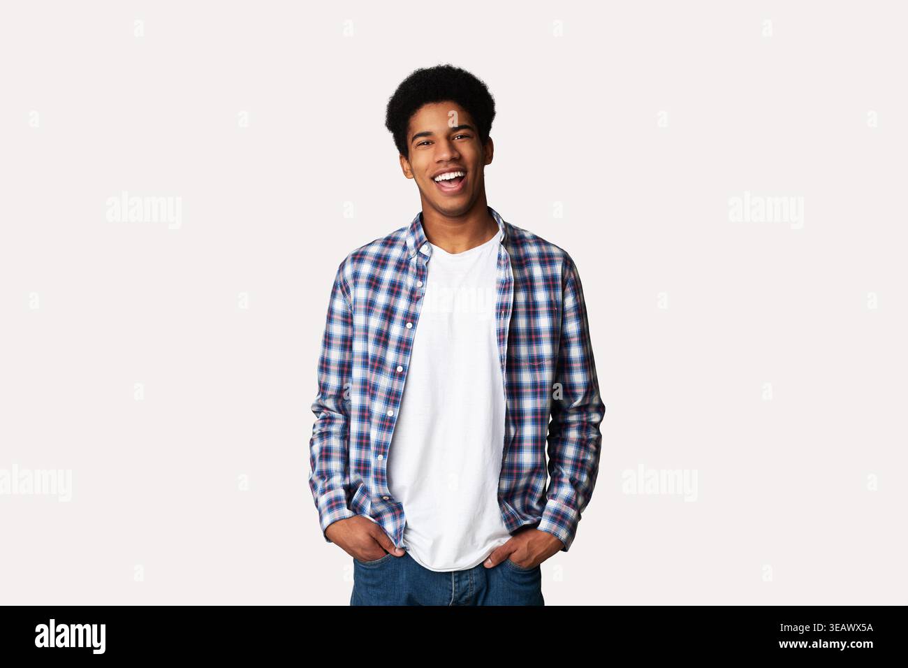 Afro Teenage Guy Posing with Hands in Pockets Stock Photo