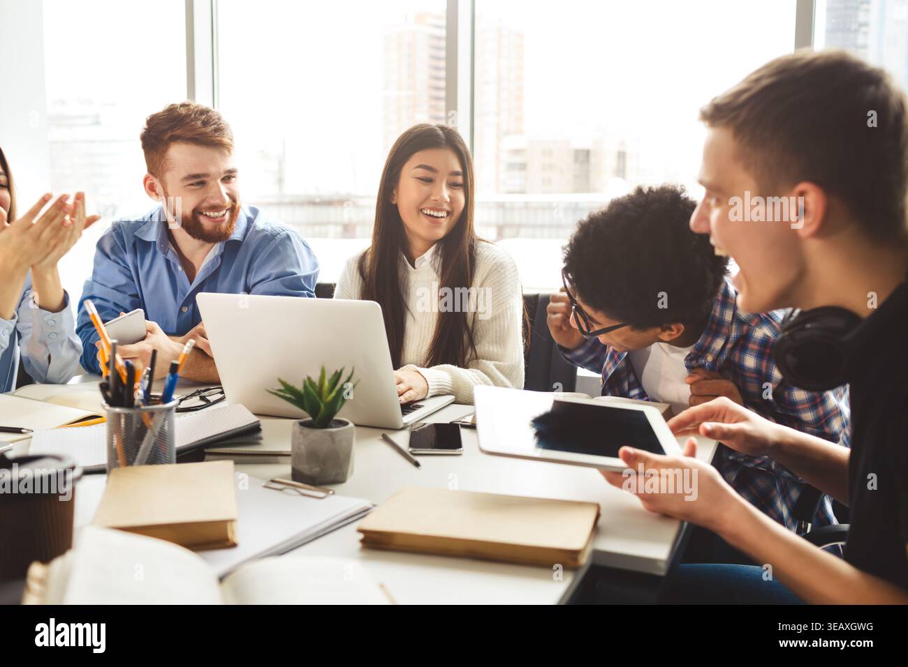 Engaging Group Discussion During a Collaborative Work Session in a Bright Office Space Stock Photo