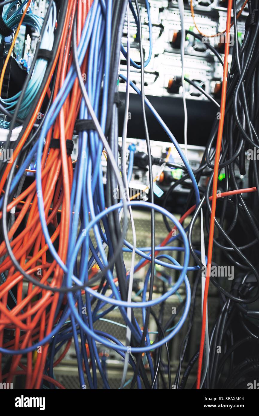 Rack, cables or hardware equipment in server room for database storage, cloud computing or tech. IT infrastructure, closeup or wiring in data center Stock Photo