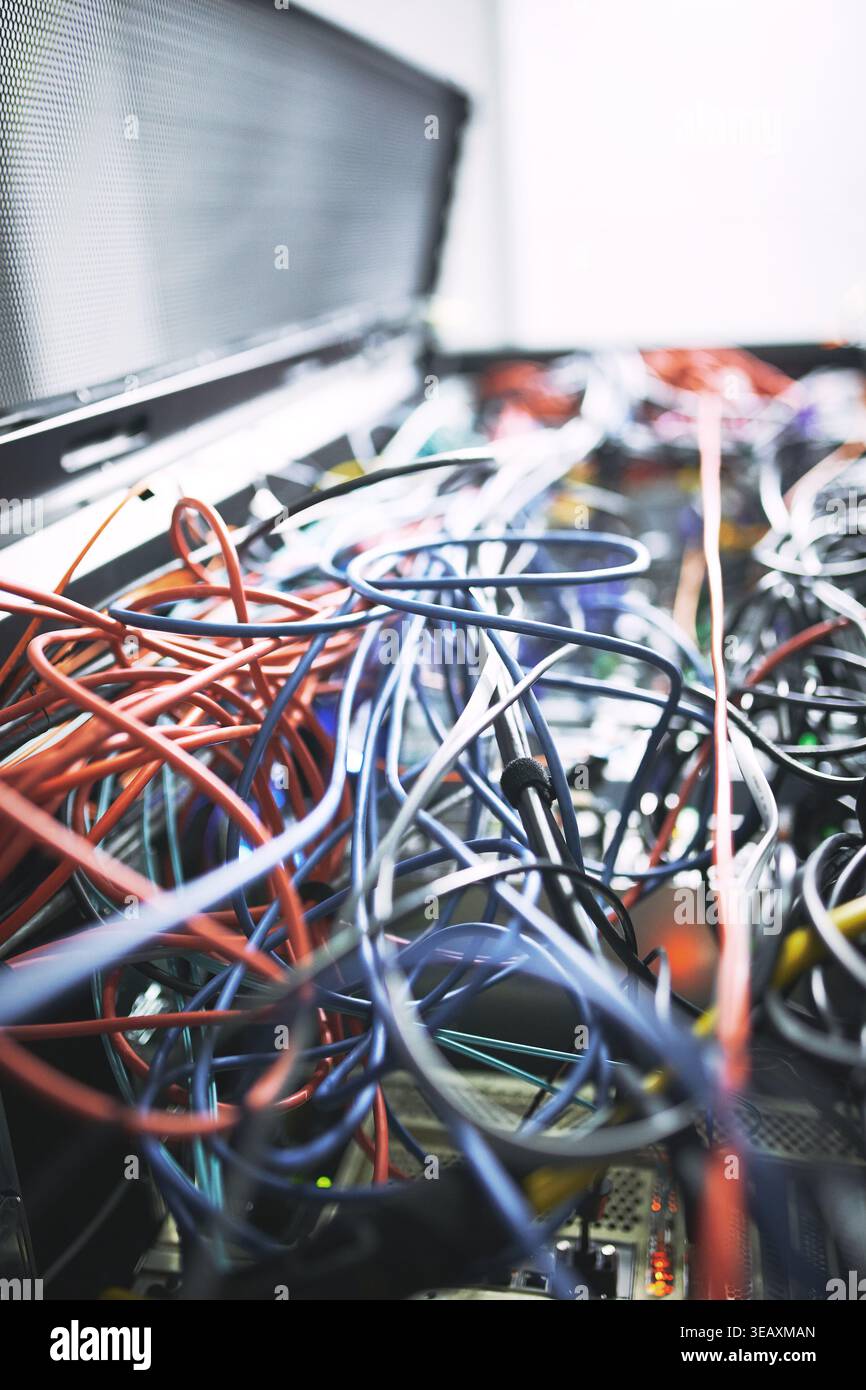 Rack, cables or hardware equipment in server room for database storage, cloud computing or tech. IT infrastructure, closeup and wiring in data center Stock Photo