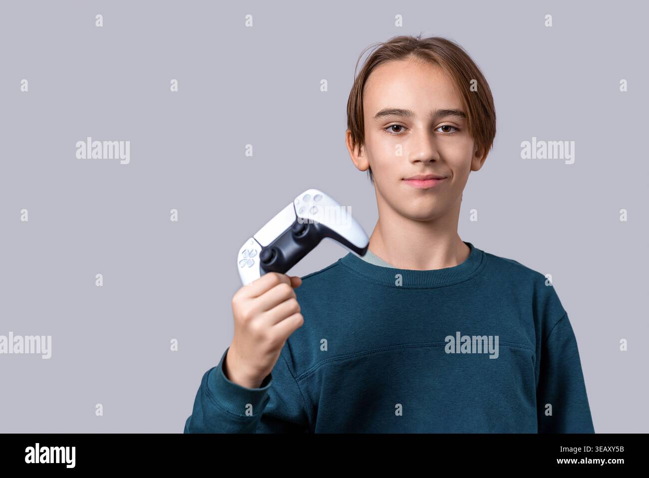 Gamer hand using video game console controller. Playing games concept. Man play a football game with video game controller. Child holding a game Stock Photo