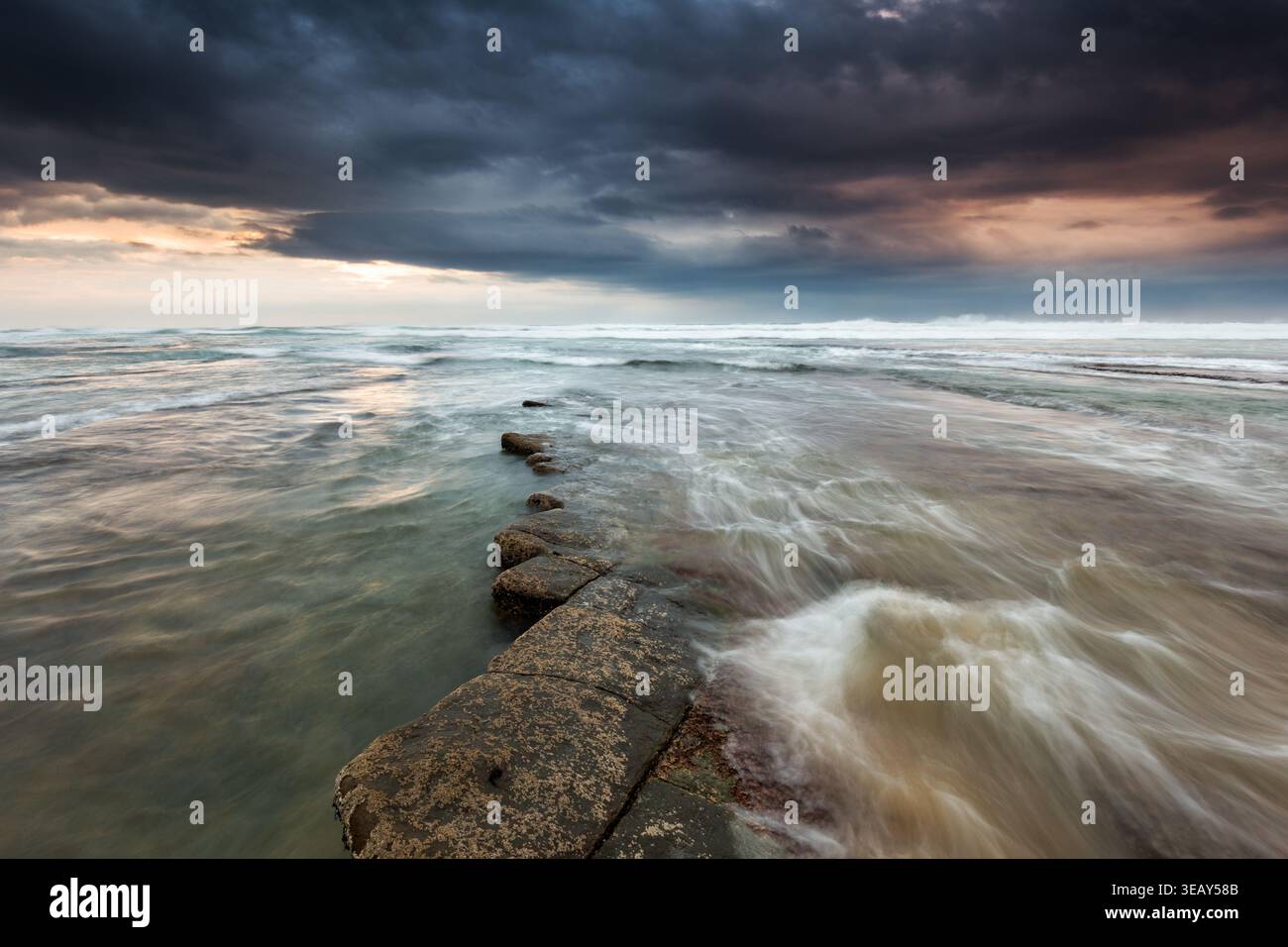Dramatic Beach Landscape with Stormy Sky Stock Photo