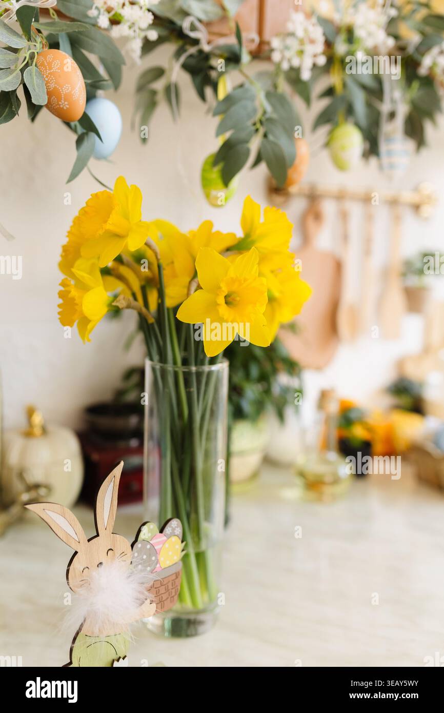 Easter table with traditional cake and cute chicks, spring Stock Photo
