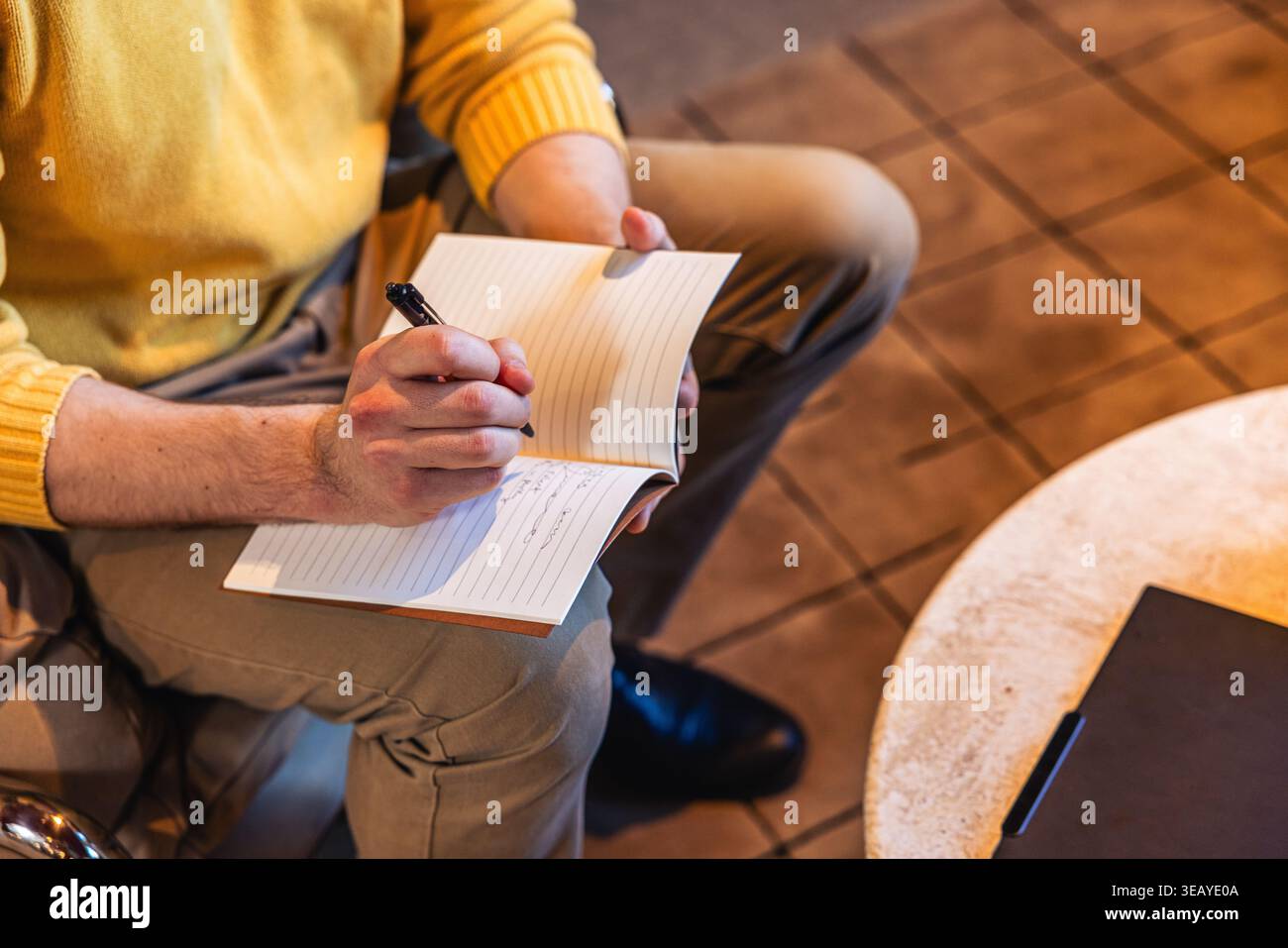 Businessman writing in a notebook Stock Photo