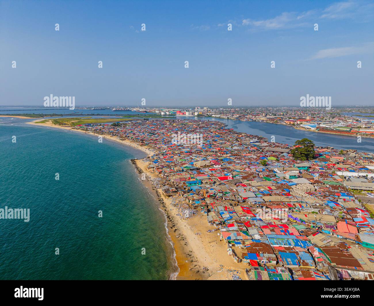Aerial view of a sprawling settlement, where vibrant rooftops meet the ...