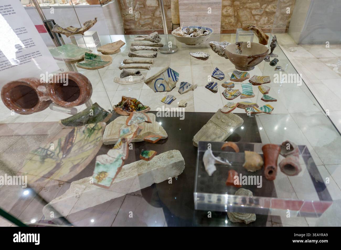 Archaeological artifacts including pottery shards and ceramic fragments ...