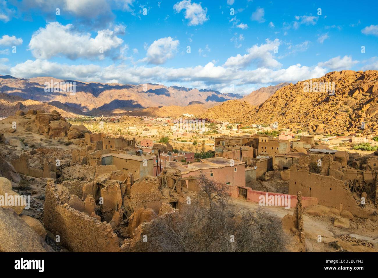 Small village with houses, mountains and large stone blocks integrated into the buildings and surroundings of the village of Tafraout, located in the Stock Photo
