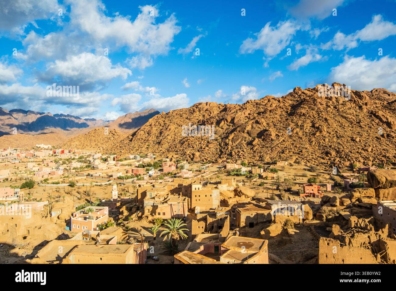 Small village with houses, mountains and large stone blocks integrated into the buildings and surroundings of the village of Tafraout, located in the Stock Photo