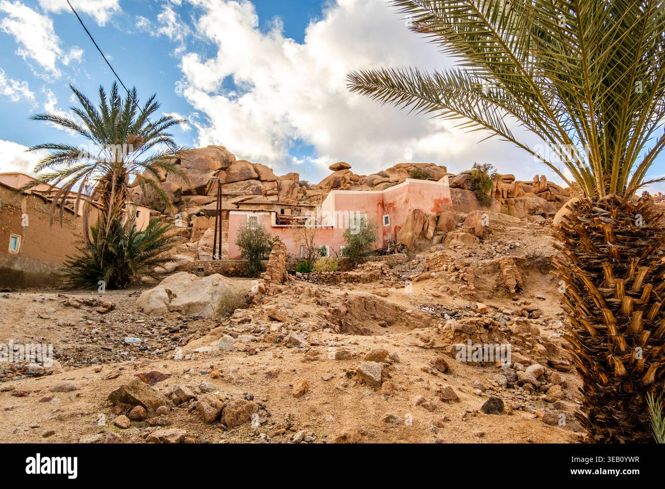 Houses built on the stones, mountains and large stone blocks integrated into the buildings and surroundings of the village of Tafraout, located in the Stock Photo