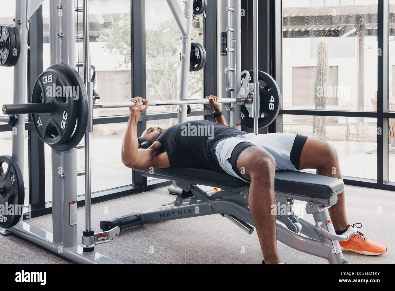 Strong Lifter Effort. Dedicated Athlete Performing Heavy Barbell Push ...