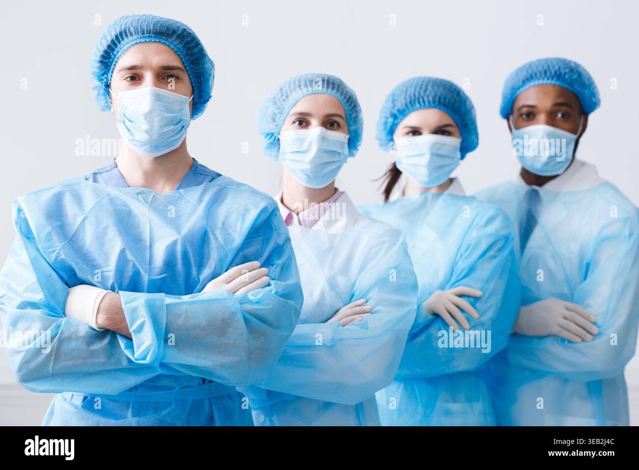 Surgeons Team Ready for Surgery. Practitioners Wearing Protective Uniforms Stock Photo