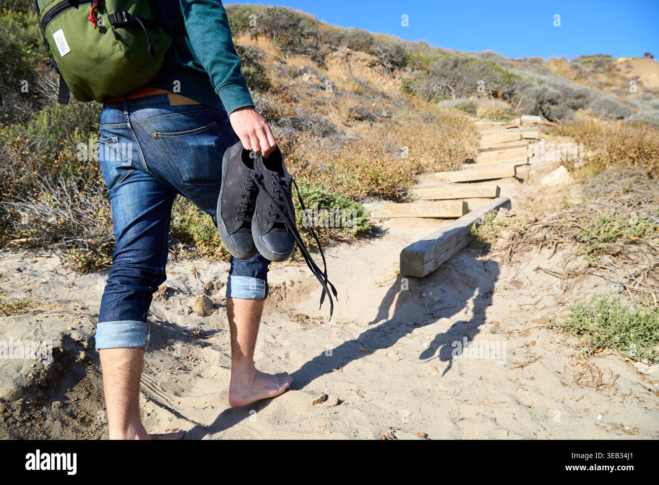 Man walking barefoot uphill hi-res stock photography and images - Alamy