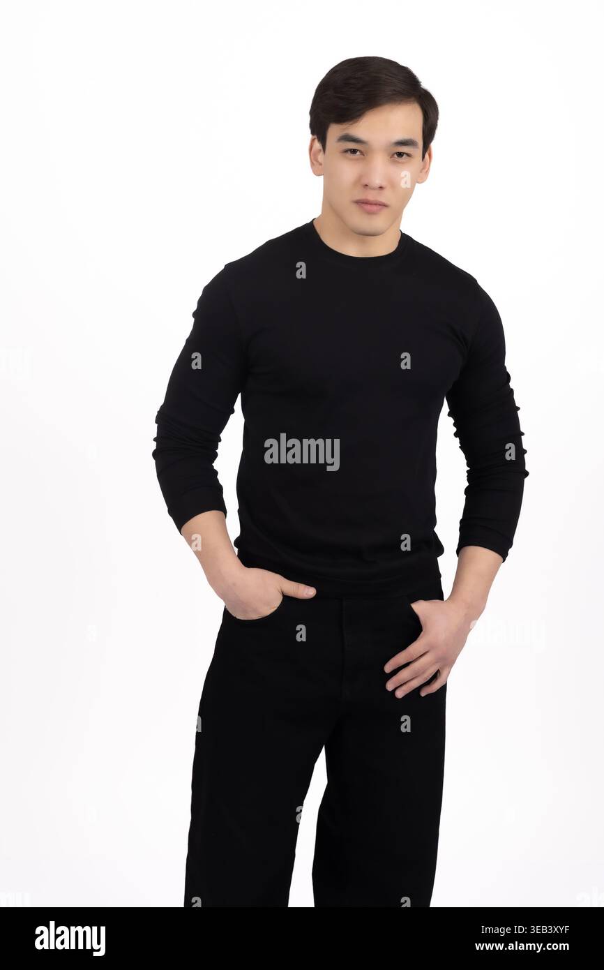 Man in black clothes standing and looking at camera Stock Photo