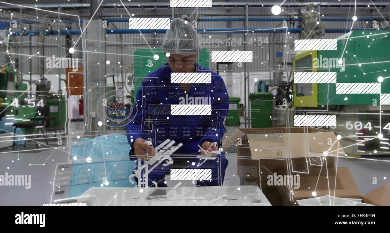 Factory Handling Components Inspecting factory worker in blue uniform and cap handling plastic ...