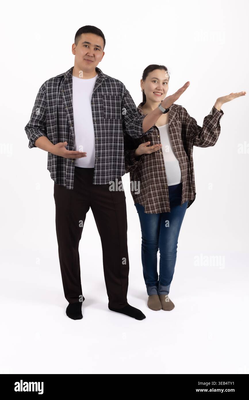 Couple posing together with a digital tablet in studio Stock Photo