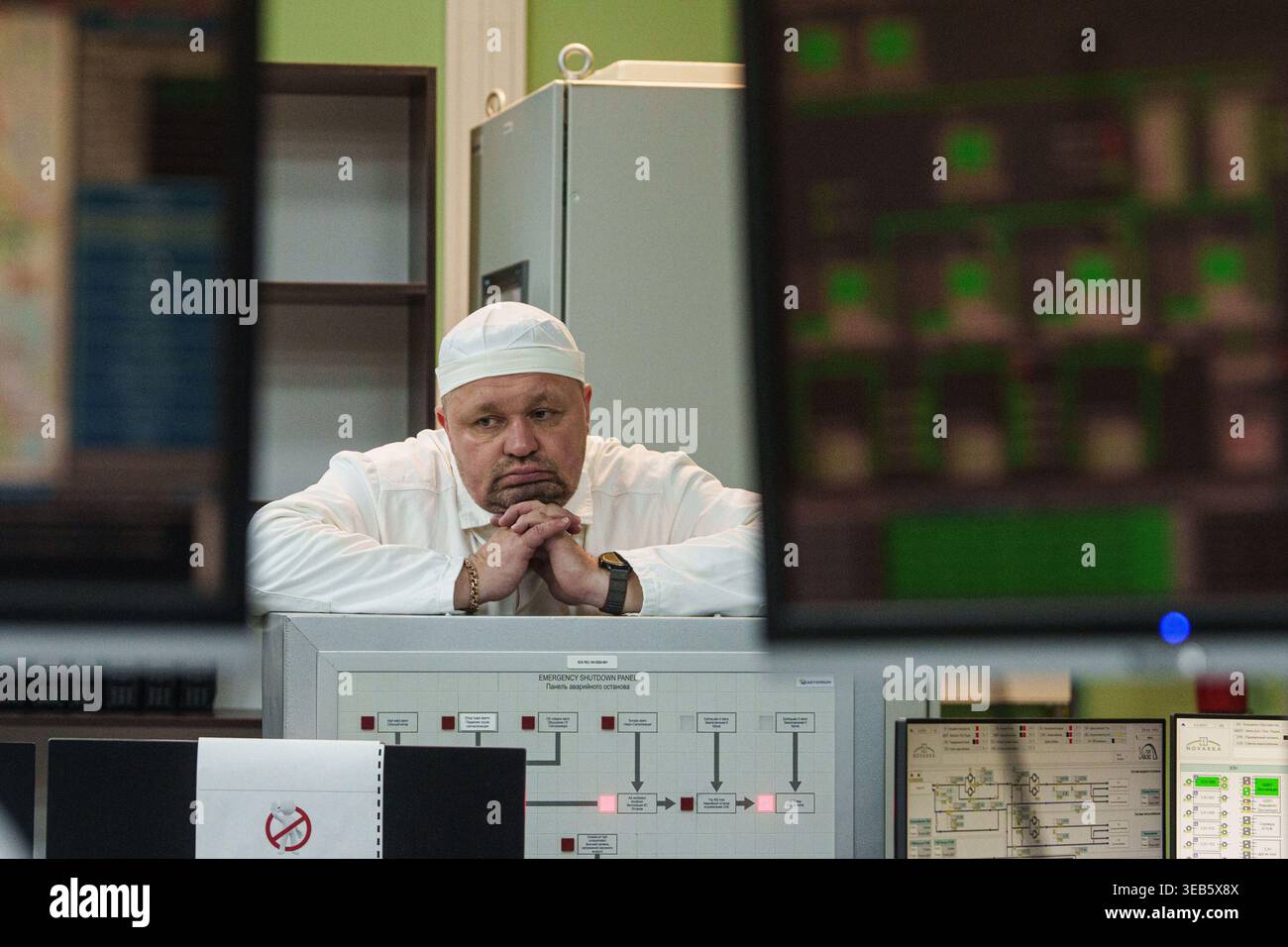 A worker at the Chernobyl nuclear power plant in Ukraine looks at ...