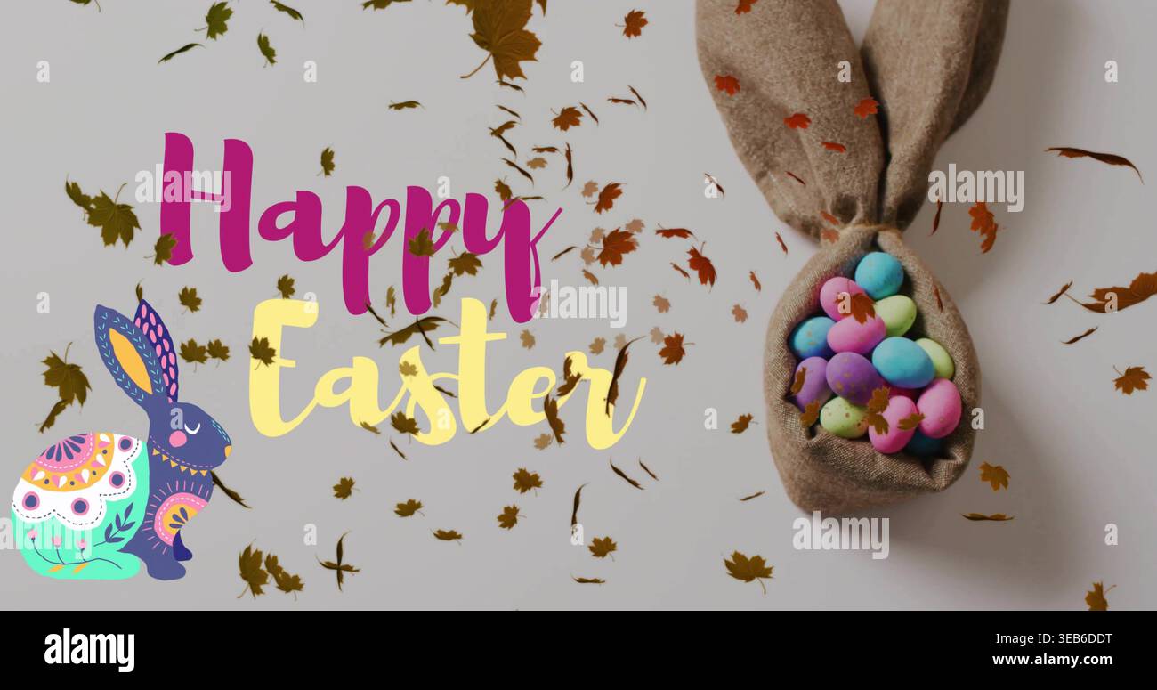 Showing bunny pouch holding pale speckled eggs on gray tabletop, with Happy Easter text, copy space Stock Photo