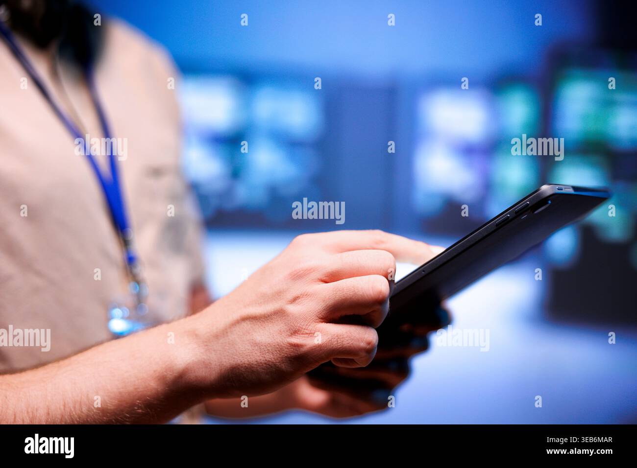 Admin checking interlinked computers creating server network, close up. Supercomputers in blurry background using parallel computing to perform complex calculations and process vast amounts of data Stock Photo