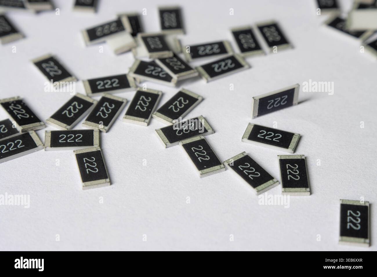 Surface mount resistors 222 scattered on white background Stock Photo