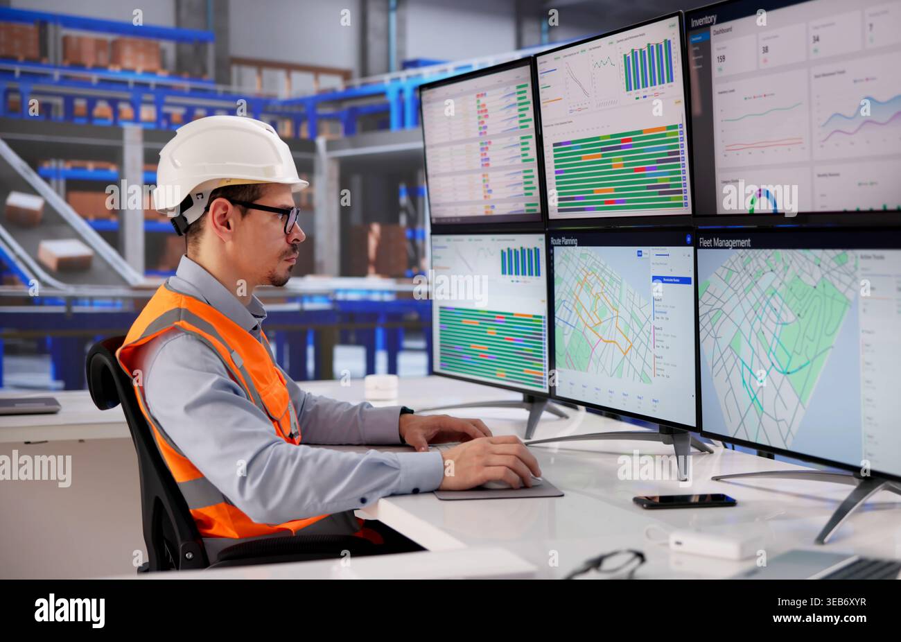 Efficient Logistics Coordinator Operating Desktop In A Bustling Distribution Hub Stock Photo