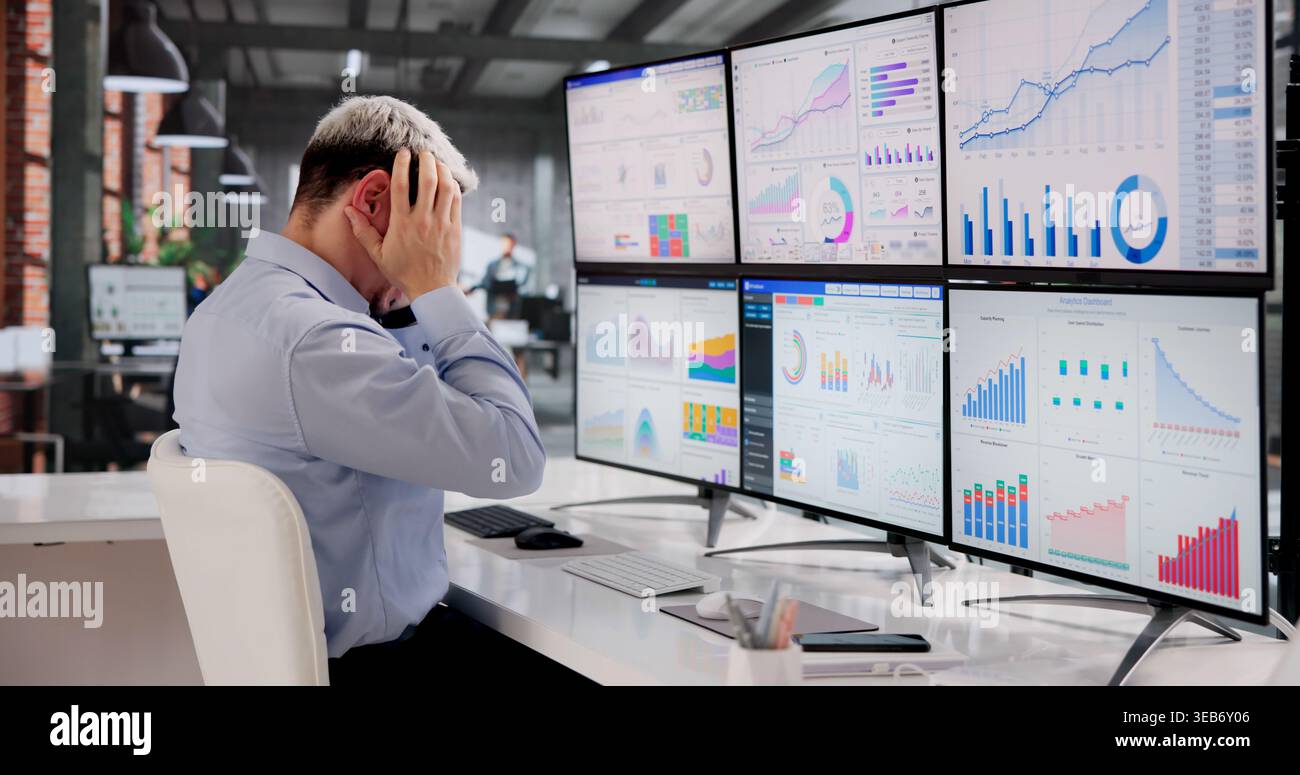 Stressed Business Analyst Struggles To Interpret Intricate Data On Screen Stock Photo
