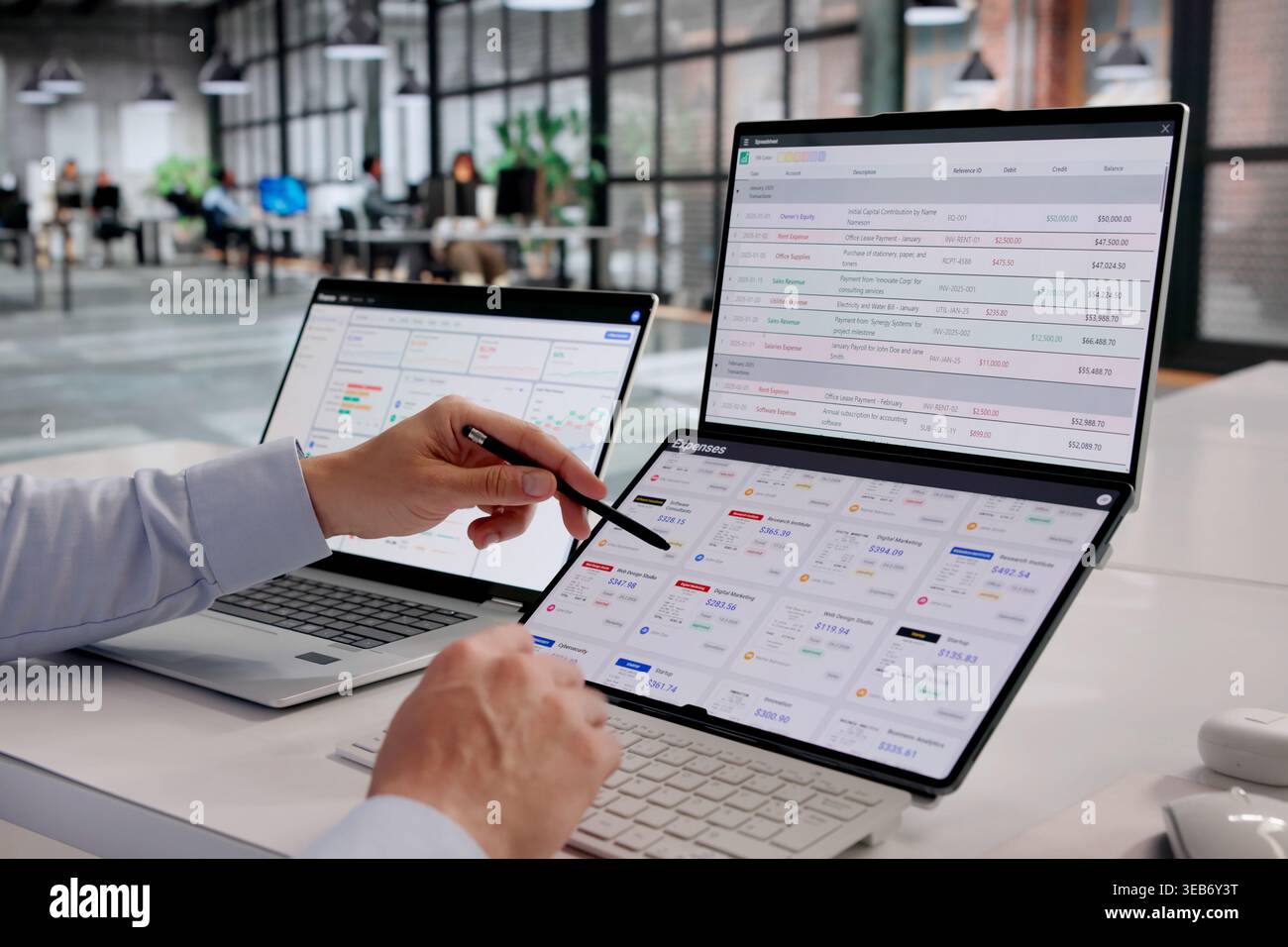 Finance Manager Analyzing Expense Reports With Sophisticated Tracking Tools Stock Photo