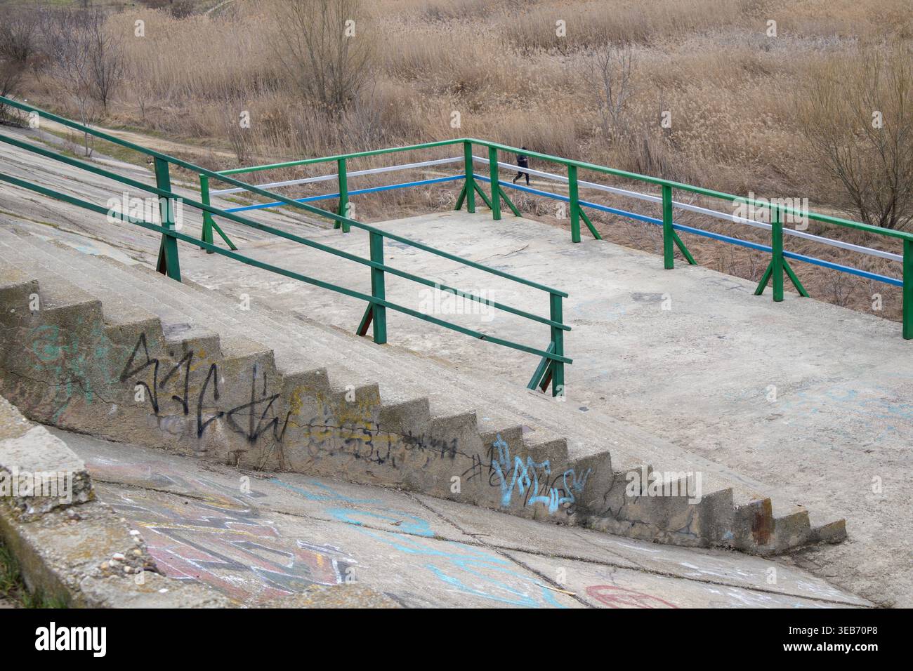Observation Platform Railing Concrete observation platform with green metal railings and graffiti ...