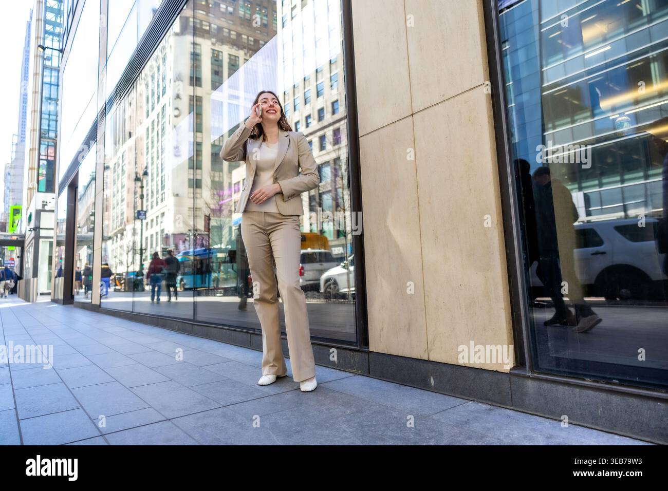Successful businesswoman talking on smartphone in manhattan Stock Photo