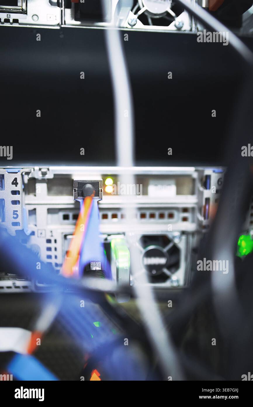 Closeup, rack and mainframe cables at data center for database, IT infrastructure and backup system. Dashboard, ethernet and server panel with Stock Photo