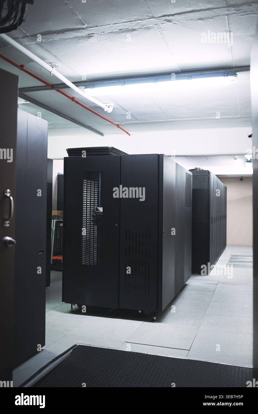 Interior, storage and servers in empty data center for cybersecurity, IT hardware and infrastructure. Mainframe, facility and database machine for Stock Photo