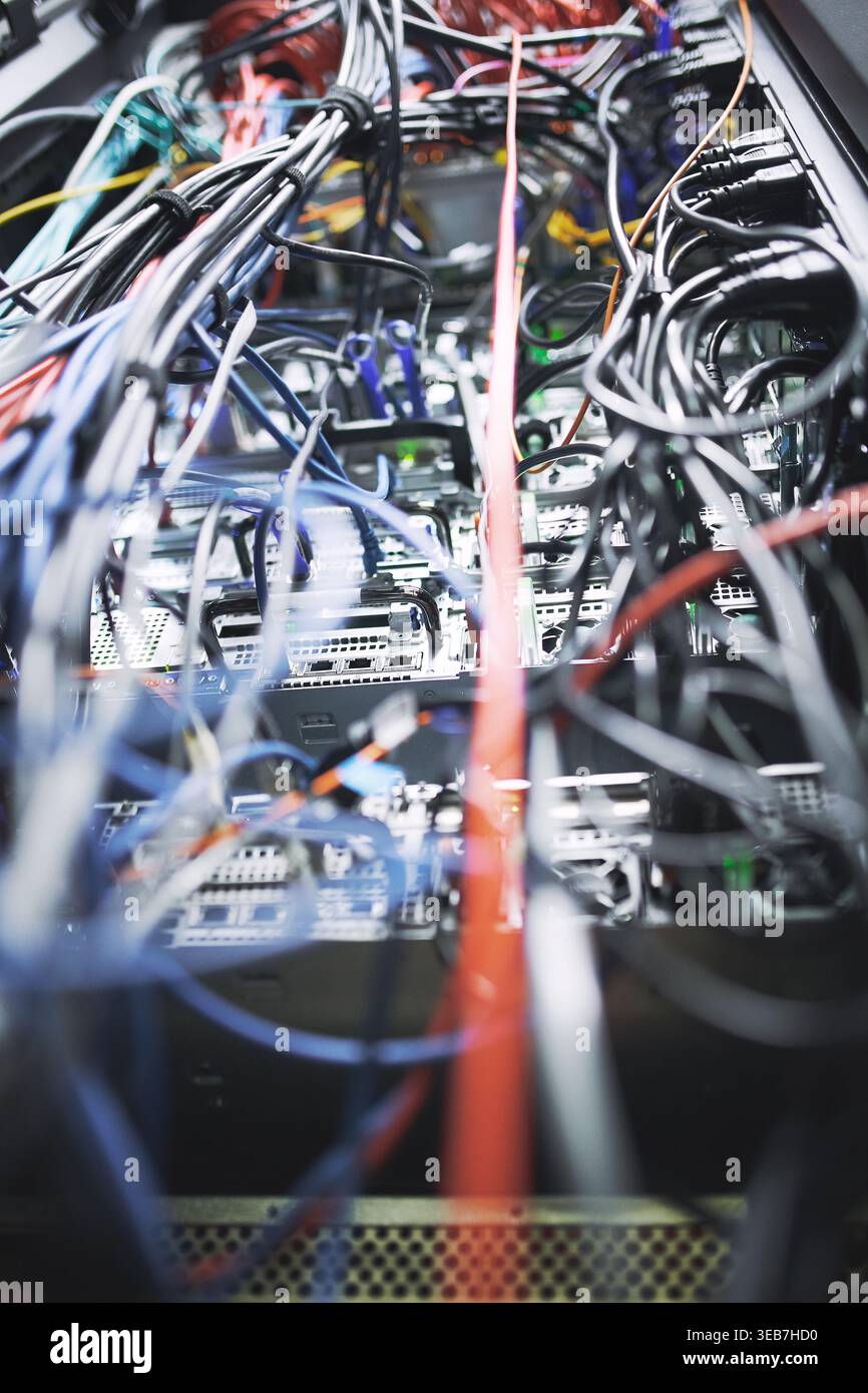 Closeup, rack and power cables in server room for database, IT infrastructure and backup system. Hardware, mainframe and optical panel with electrical Stock Photo