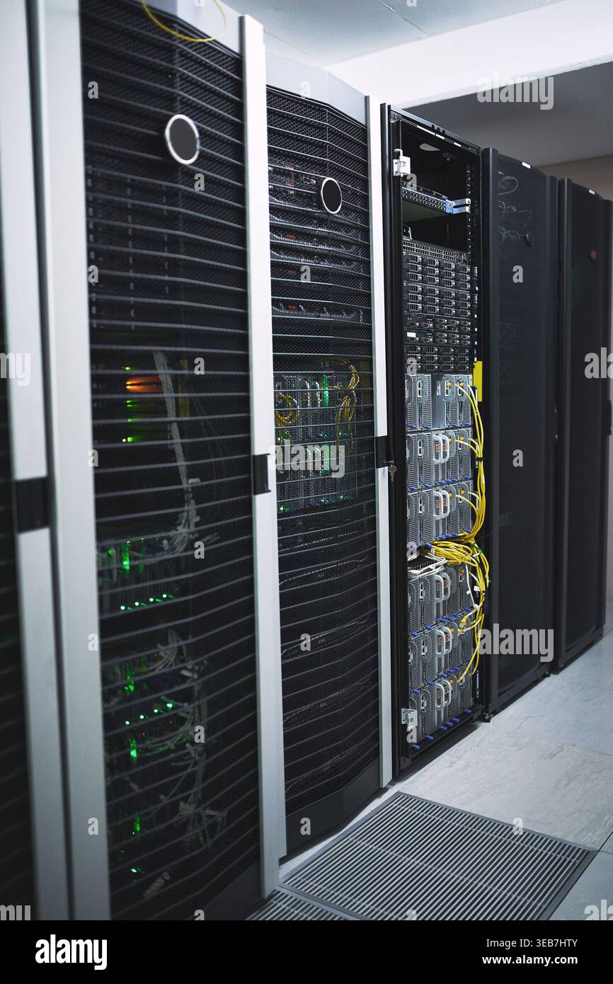 Storage, servers and network in empty data center for cybersecurity, IT hardware and infrastructure. Interior, mainframe and database machine for Stock Photo