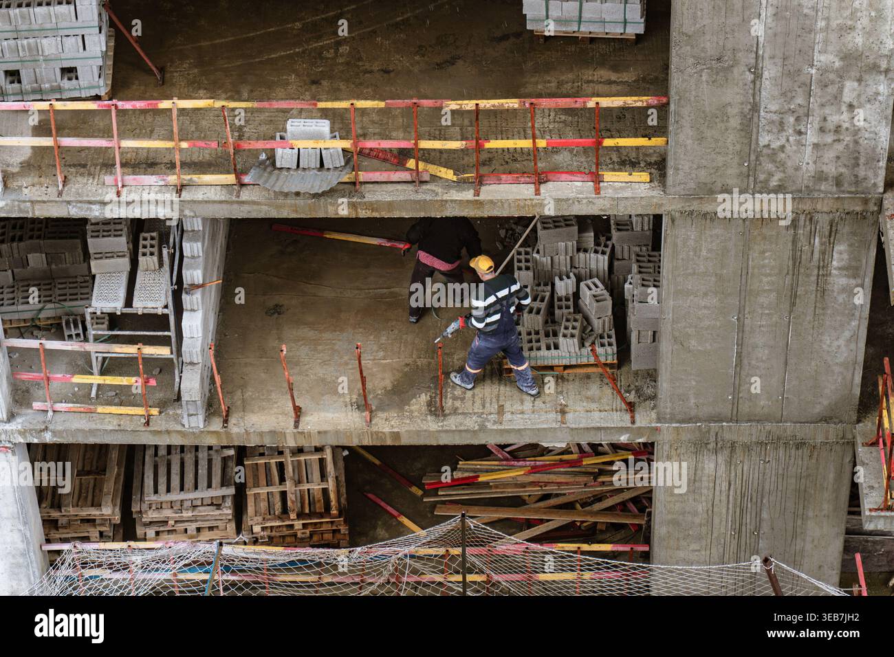 Batumi, georgia 21 april 2026: workers constructing a modern high-rise ...