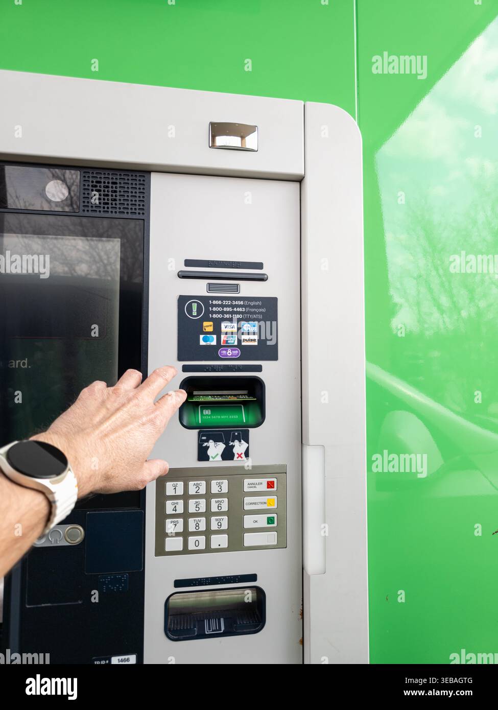 Modern digital banking interaction and secure ATM user experience. Stock Photo