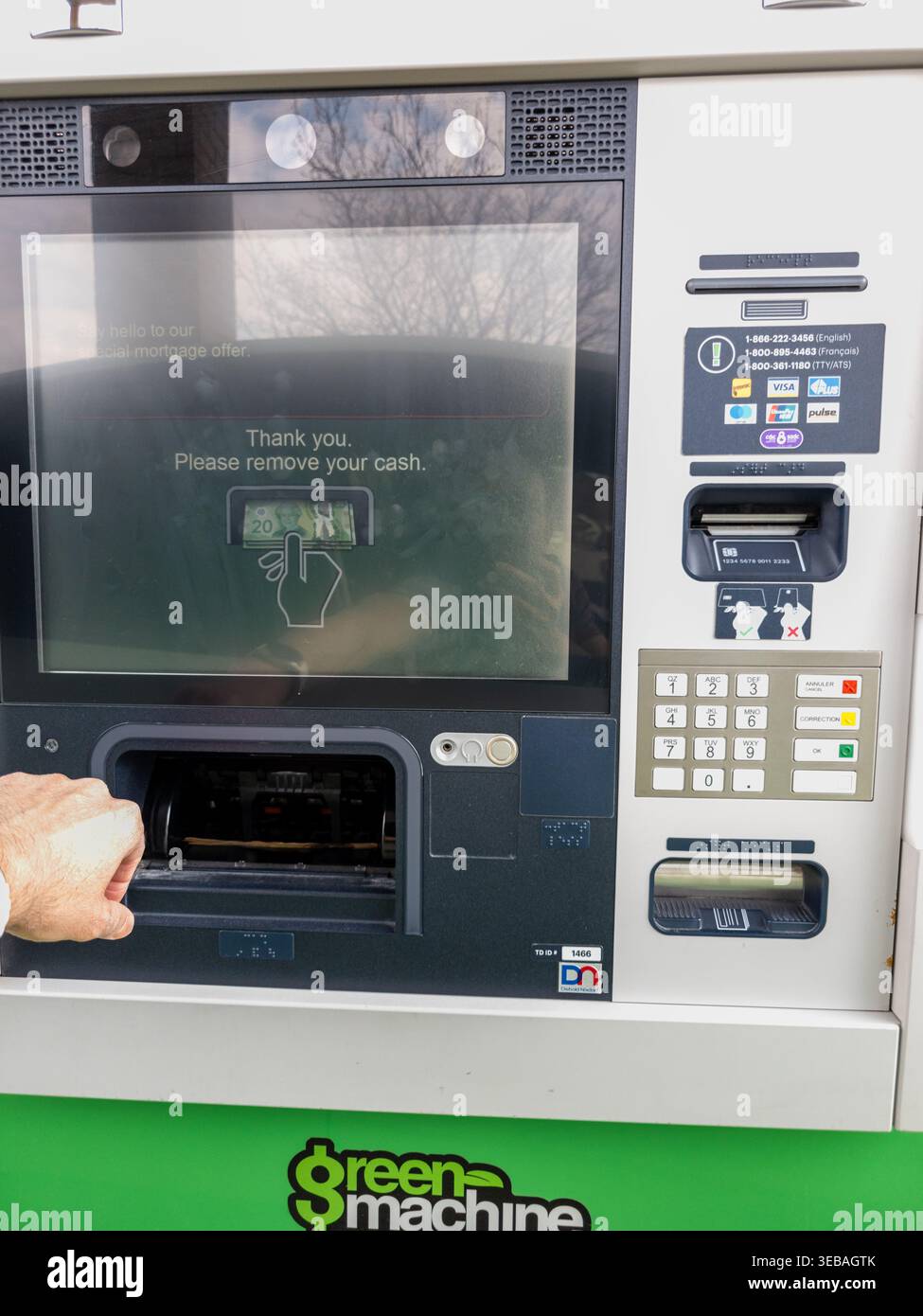 Modern digital banking interaction and secure ATM user experience. Stock Photo