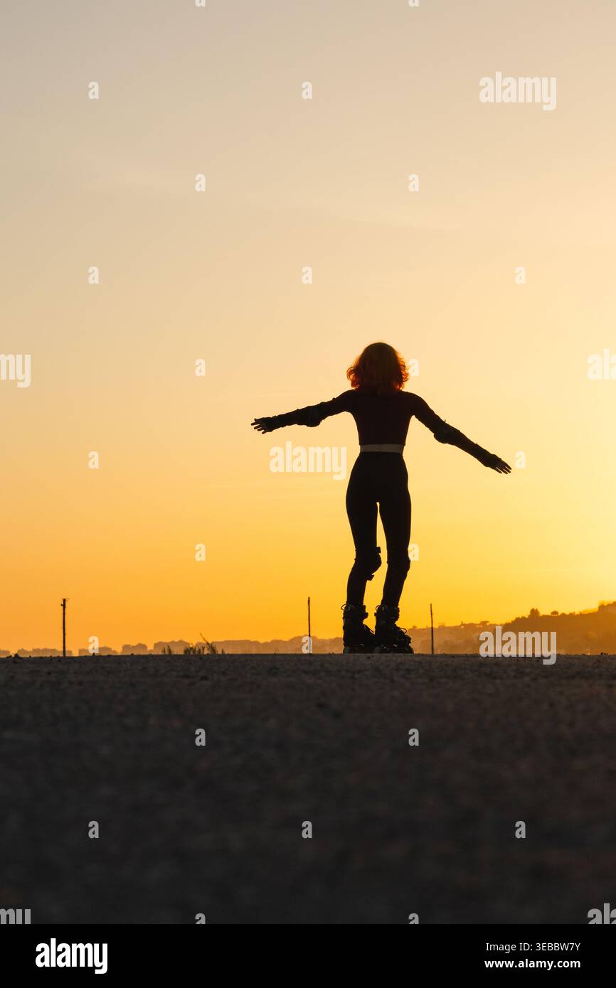Girl open arms sunset hi-res stock photography and images - Alamy
