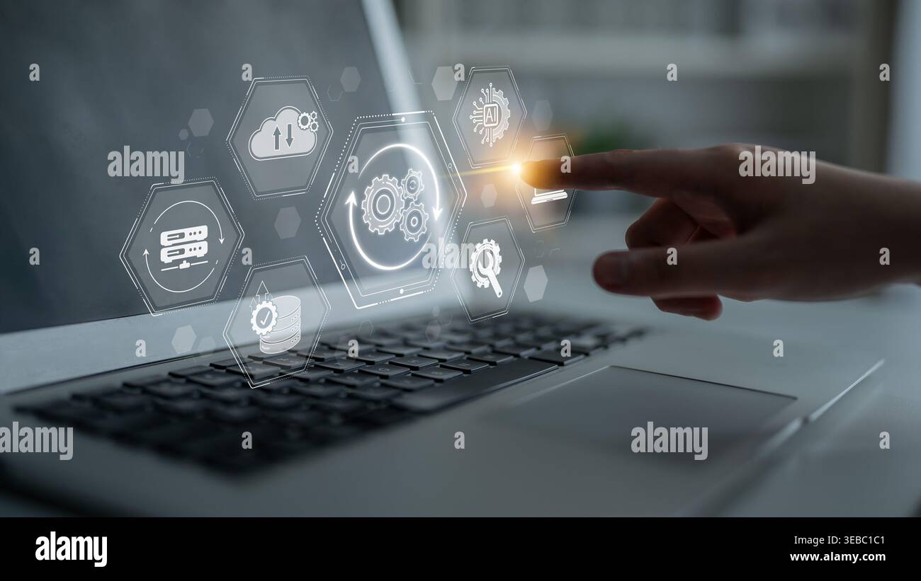 Hand Interacting with Futuristic Digital Interface on Laptop Display Featuring Icons of Technology, Data Analytics, and Cloud Computing Integration Stock Photo