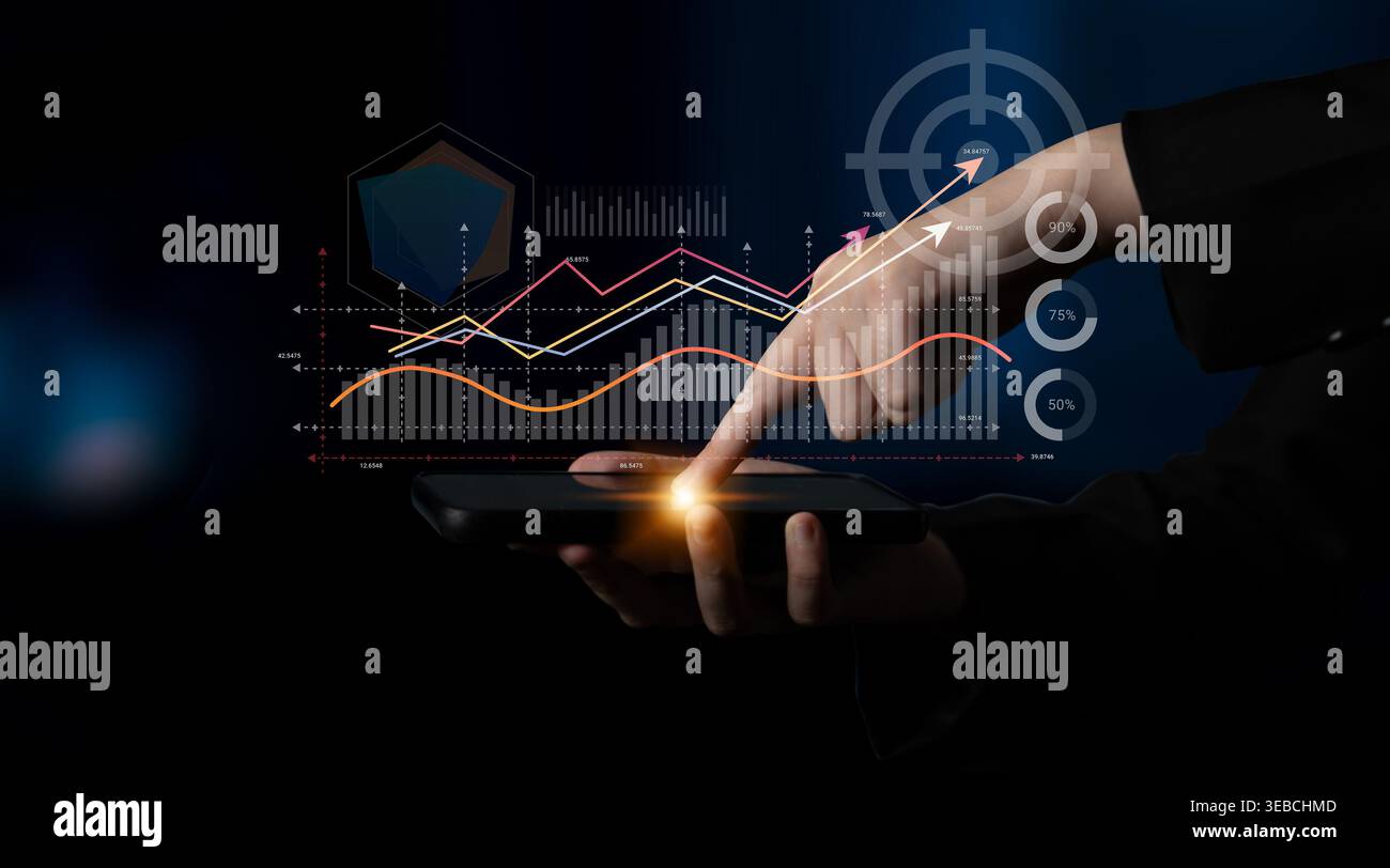 A hand interacts with a smartphone displaying vibrant data visualization. The image represents modern analytics and trends, highlighting performance Stock Photo