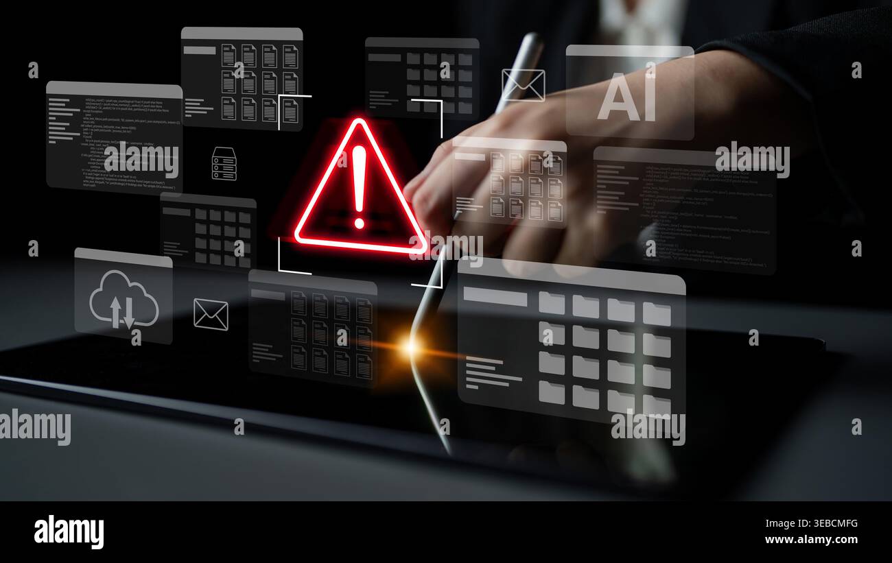 A business professional interacts with a digital tablet displaying a warning symbol, emphasizing crucial software risks and the importance of Stock Photo