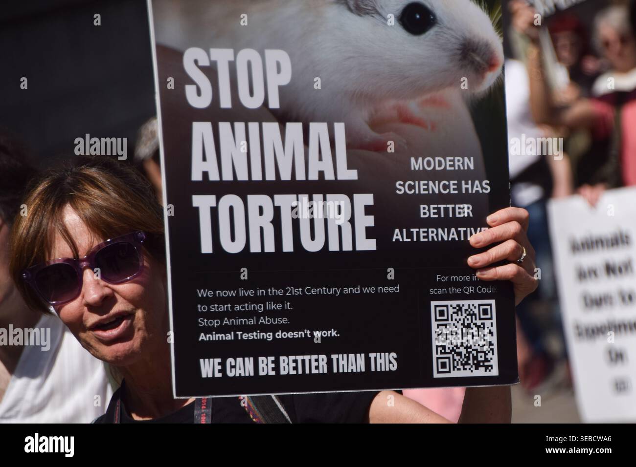 Lab Animal Rights Flyers A protester holds a placard opposed to animal experiments during the ...