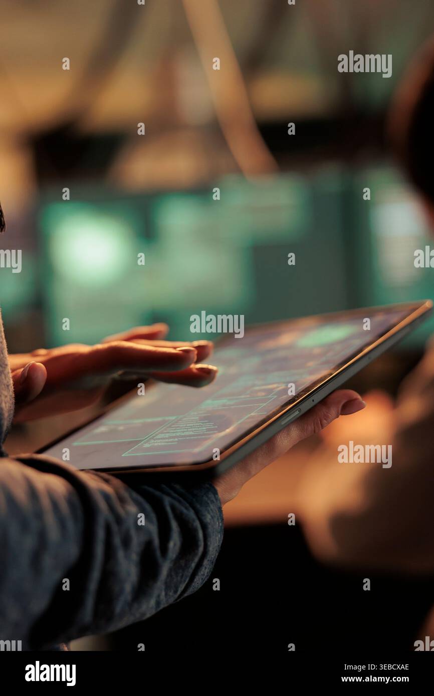 Server illegal access, hacker using malware on digital tablet, computer system password cracking. Cyberattack, internet thieves stealing financial data, coding virus, programming malicious software Stock Photo