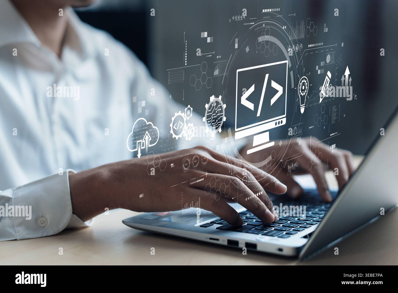 A developer engages in programming on a laptop, surrounded by visual graphics representing coding and web development concepts in a contemporary Stock Photo