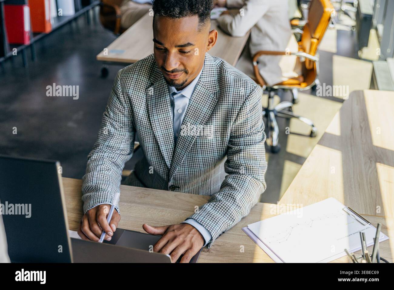 Developer Working Diligently. Software Engineer Focused On Task With Notes And Two Monitors Visible Stock Photo