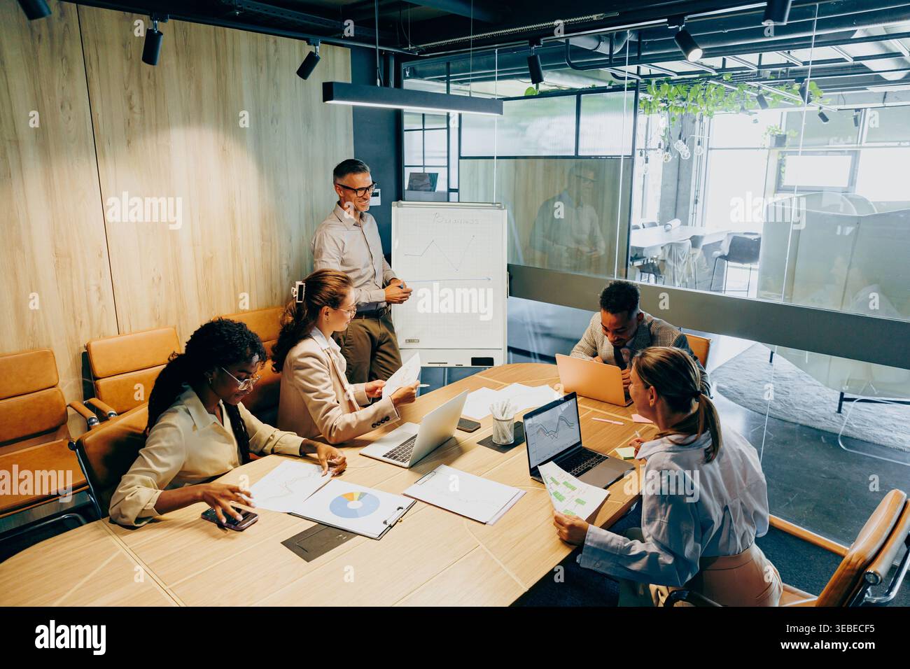 Modern office setting focused on effective project task distribution Stock Photo
