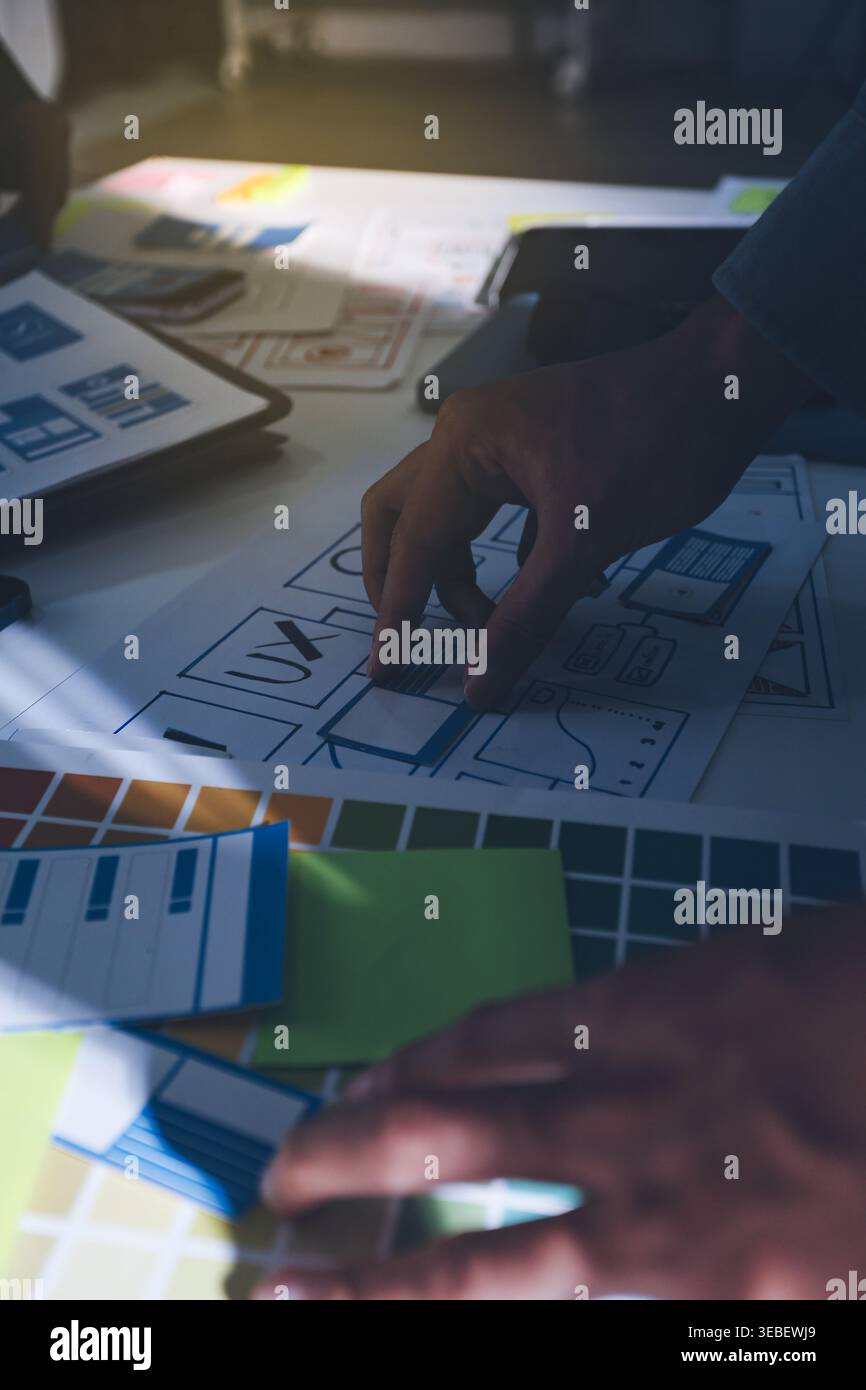 Team of Program Developer Collaborating on UXUI Design Planning in a Modern Office Environment Stock Photo
