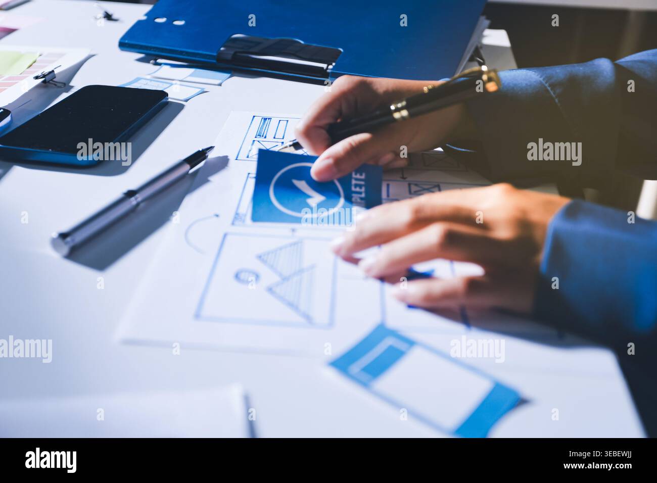 Team of Program Developer Collaborating on UXUI Design Planning in a Modern Office Environment Stock Photo