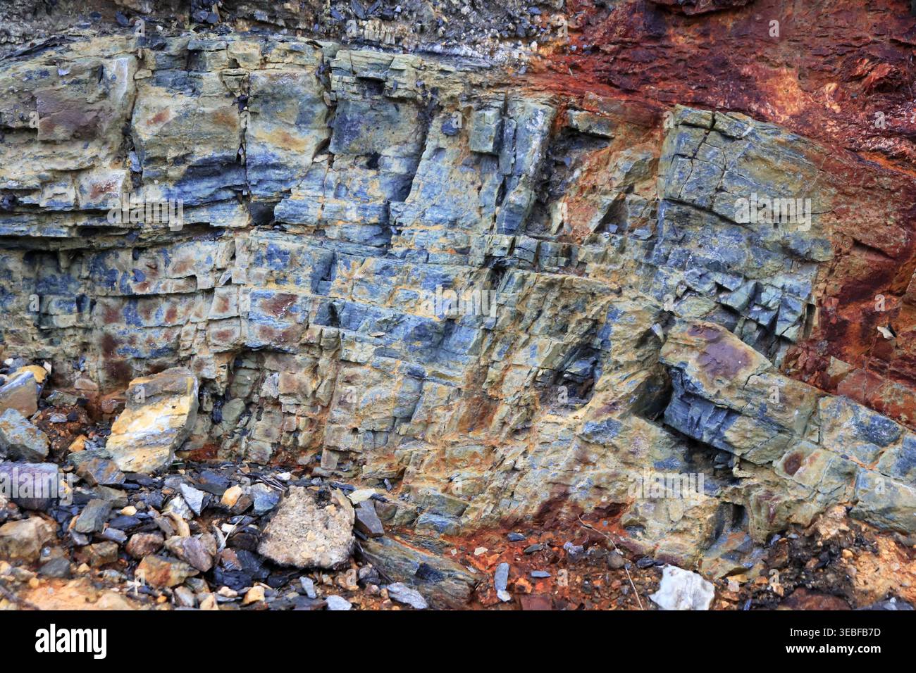Layered rock with a rustic parts texture. Mountain pattern background. Stock Photo