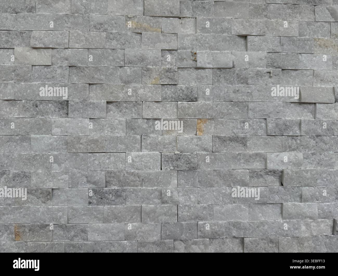 Stone brick wall texture creating rough gray background with unique pattern. Mobile photo Stock Photo